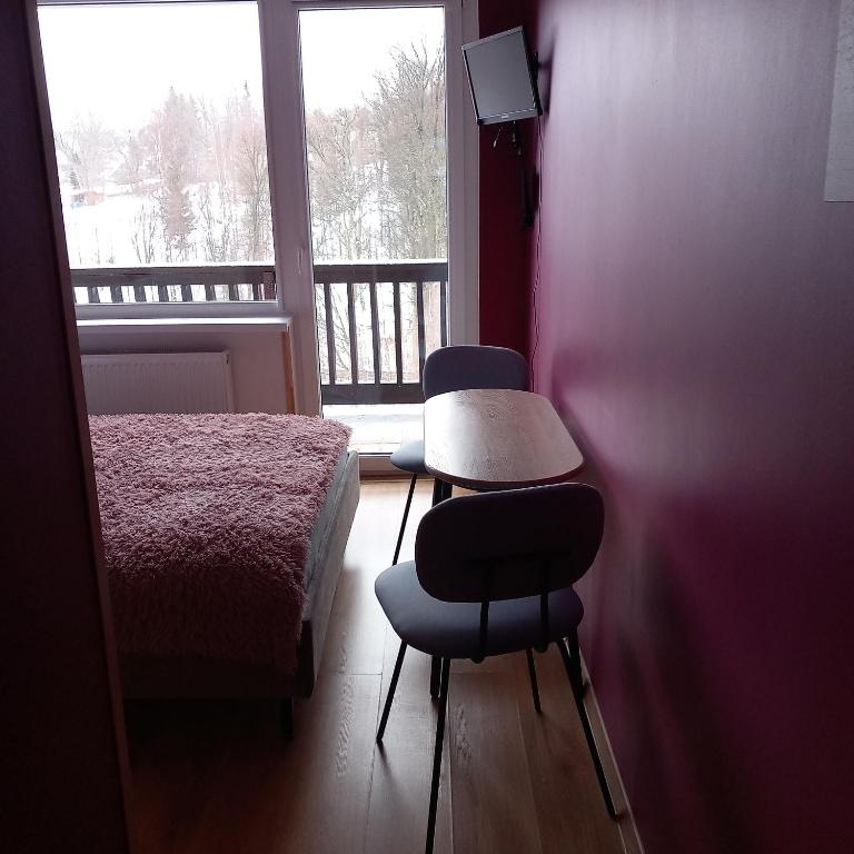 Postel nebo postele na pokoji v ubytování Willa KaMa