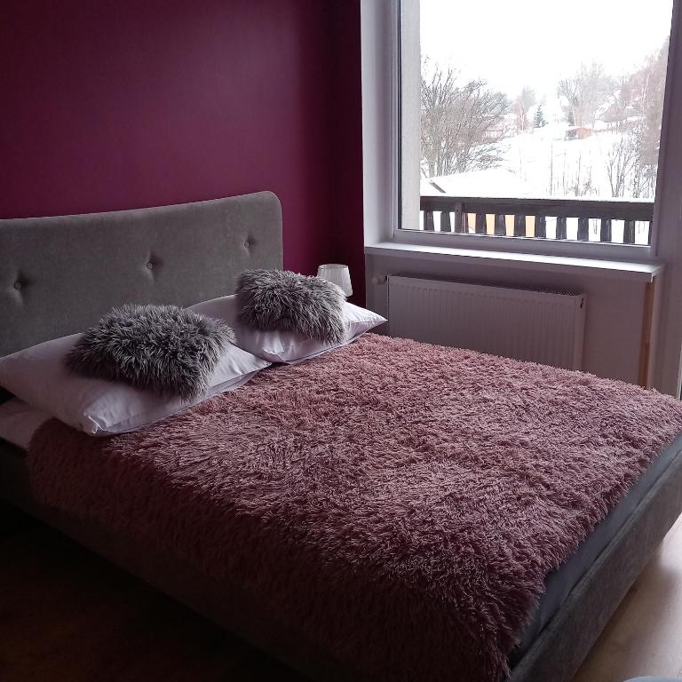 Postel nebo postele na pokoji v ubytování Willa KaMa