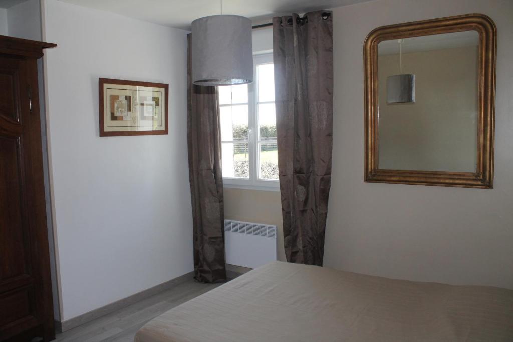 Ein Bett oder Betten in einem Zimmer der Unterkunft Ferme du lin : Rosalin