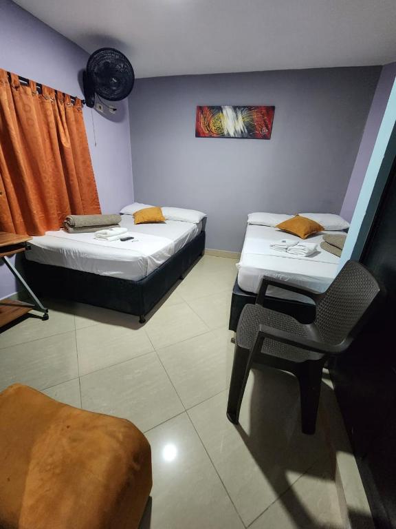 Postel nebo postele na pokoji v ubytování Hotel Laureles Home