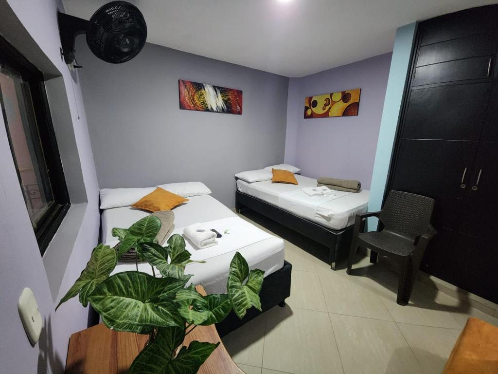 Postel nebo postele na pokoji v ubytování Hotel Laureles Home