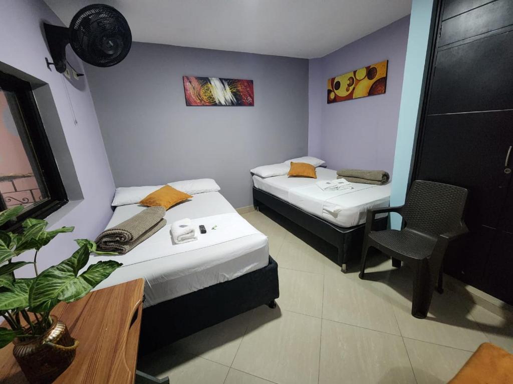 Postel nebo postele na pokoji v ubytování Hotel Laureles Home