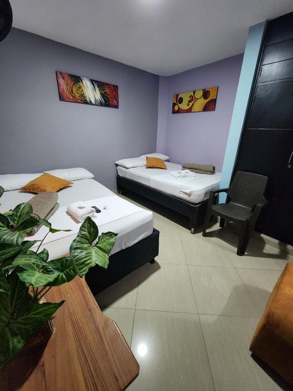 Postel nebo postele na pokoji v ubytování Hotel Laureles Home
