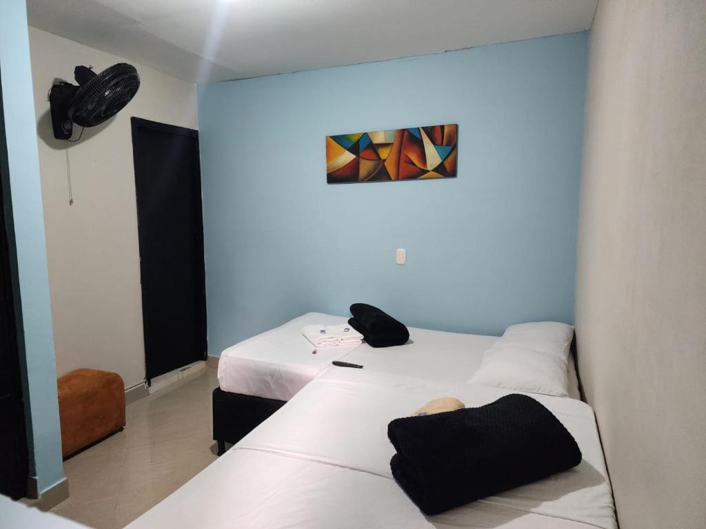 Postel nebo postele na pokoji v ubytování Hotel Laureles Home
