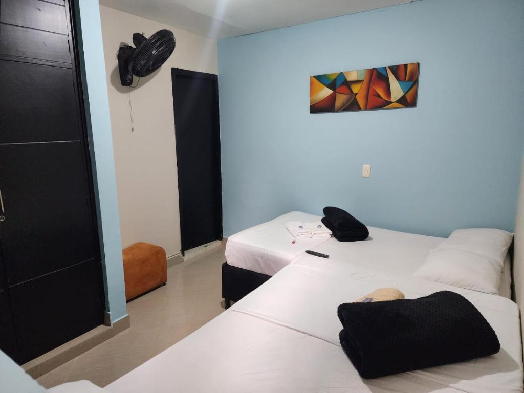 Postel nebo postele na pokoji v ubytování Hotel Laureles Home