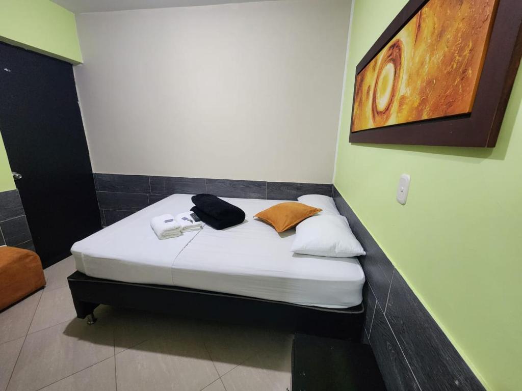 Postel nebo postele na pokoji v ubytování Hotel Laureles Home