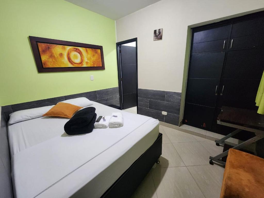 Postel nebo postele na pokoji v ubytování Hotel Laureles Home