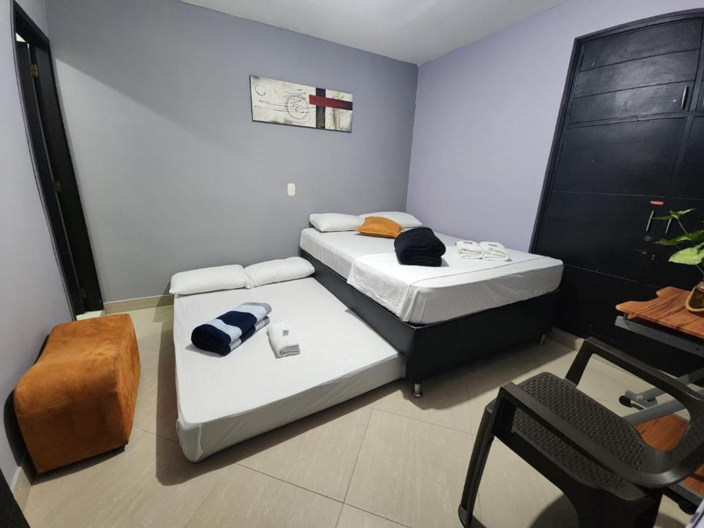 Postel nebo postele na pokoji v ubytování Hotel Laureles Home