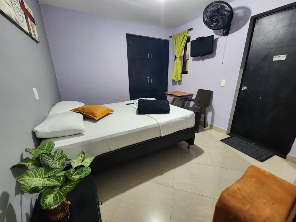 Postel nebo postele na pokoji v ubytování Hotel Laureles Home