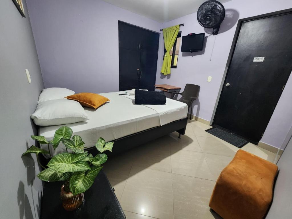 Postel nebo postele na pokoji v ubytování Hotel Laureles Home