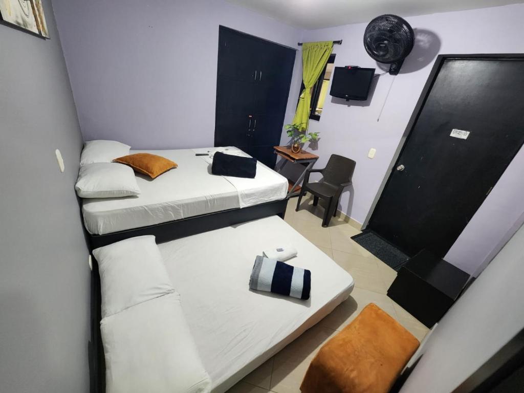 Postel nebo postele na pokoji v ubytování Hotel Laureles Home