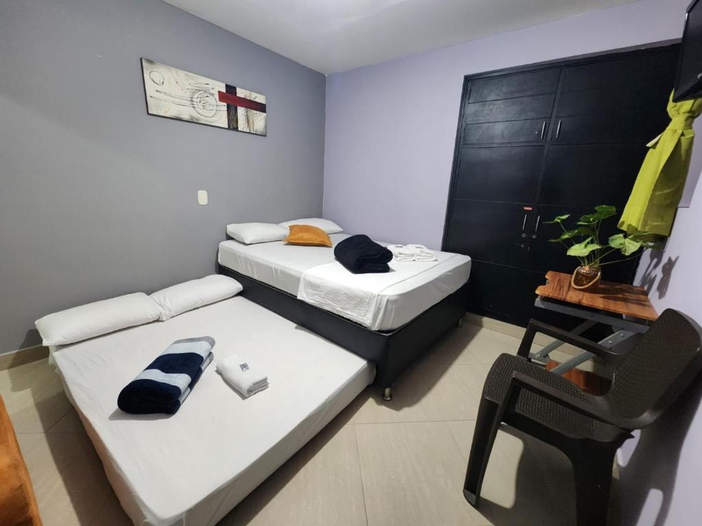 Postel nebo postele na pokoji v ubytování Hotel Laureles Home