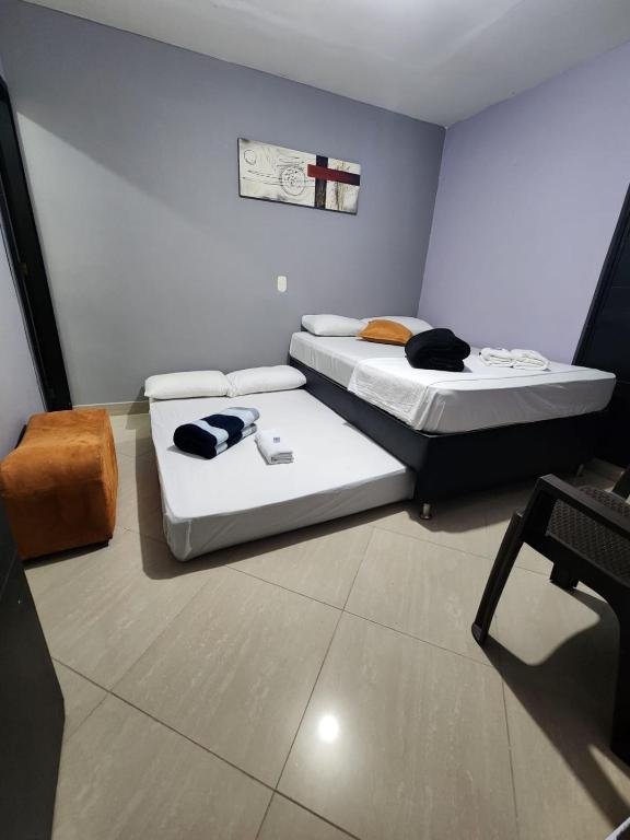 Postel nebo postele na pokoji v ubytování Hotel Laureles Home