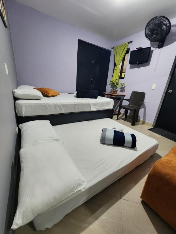Postel nebo postele na pokoji v ubytování Hotel Laureles Home