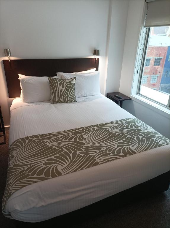 Postel nebo postele na pokoji v ubytování Alto Hotel On Bourke