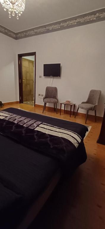 Postel nebo postele na pokoji v ubytování Yoya Hur Pyramids inn