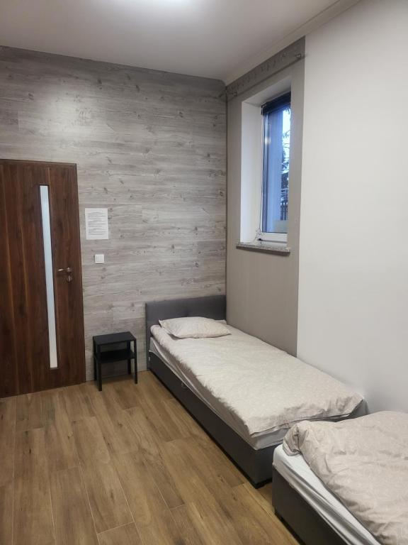 Postel nebo postele na pokoji v ubytování Rooms4Rest Bokserska - Private rooms for tourists - ATR Consulting Sp, z o,o,