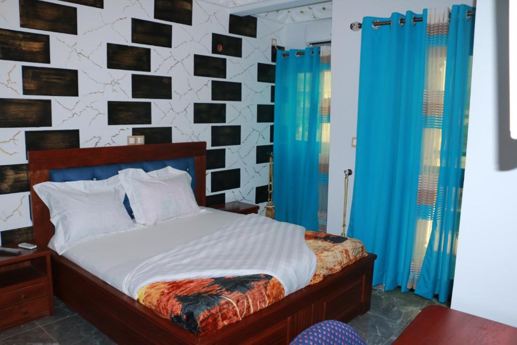 Postel nebo postele na pokoji v ubytování DEUDJUI HOTEL