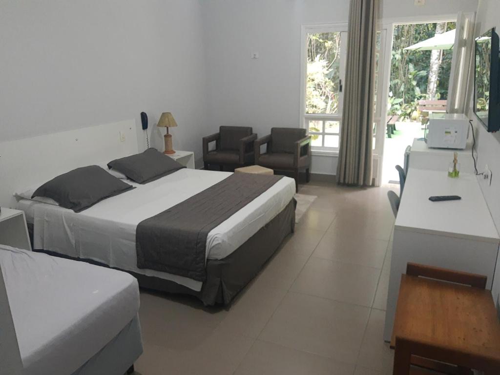 Postel nebo postele na pokoji v ubytování Flat com serviços na Riviera