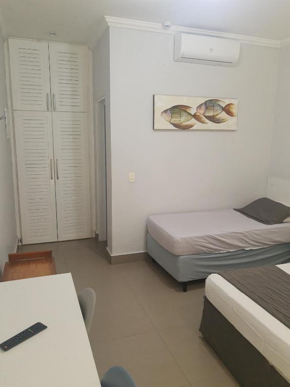 Postel nebo postele na pokoji v ubytování Flat com serviços na Riviera