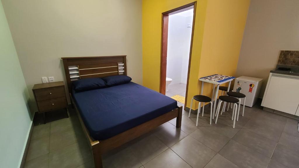 Katil atau katil-katil dalam bilik di Aconchego Flats em Olímpia