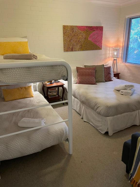 Postel nebo postele na pokoji v ubytování Killcare Beach House