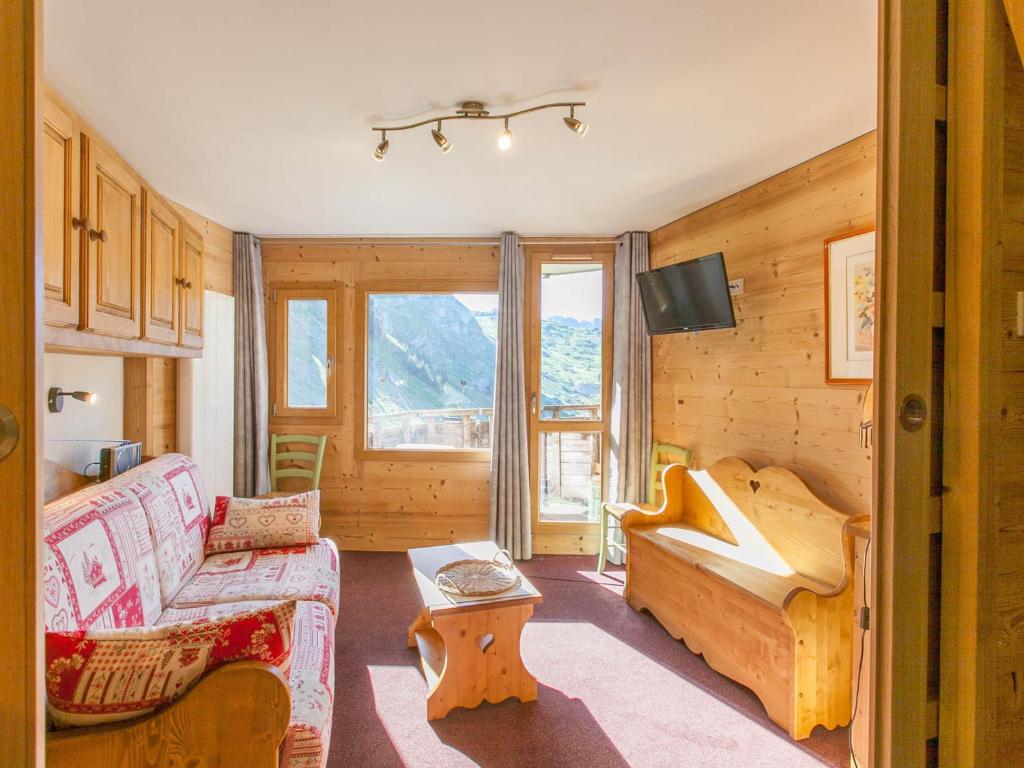 a living room with a couch and a table at Studio Avoriaz, 1 pièce, 4 personnes - FR-1-314-236 in Morzine