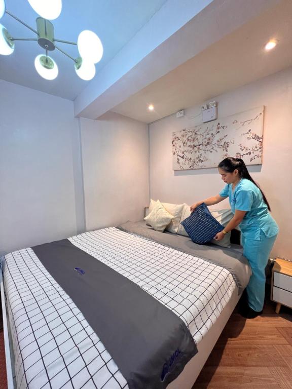 Postel nebo postele na pokoji v ubytování JMCL RESIDENCES