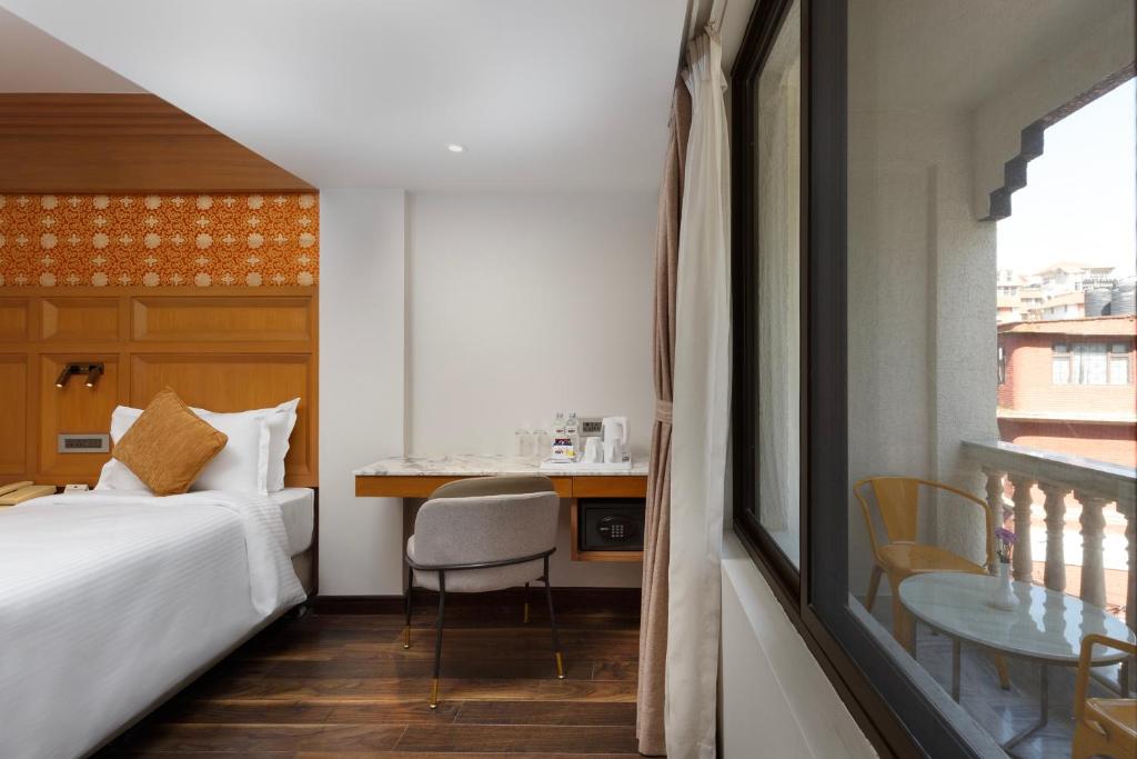Postel nebo postele na pokoji v ubytování Hotel Tibet