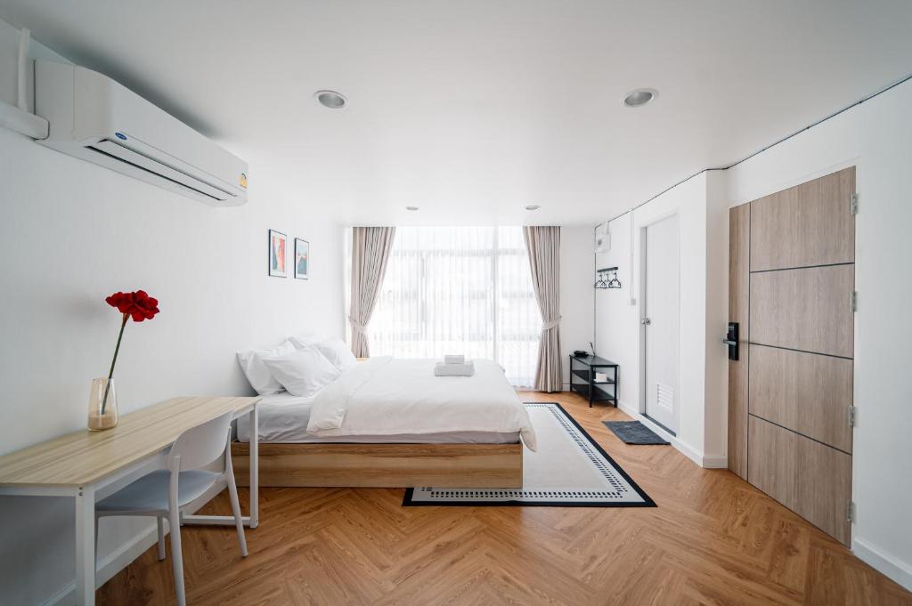 Postel nebo postele na pokoji v ubytování Mitt Haus (Lat Phrao Soi 5)