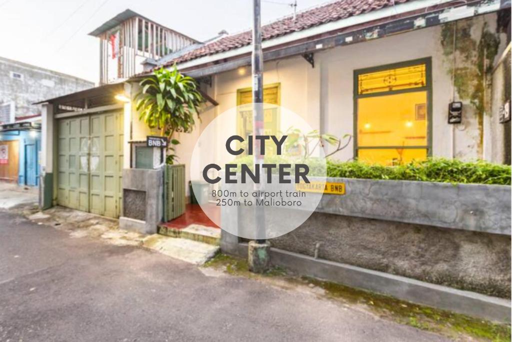 a city center sign in front of a building at Yogyakarta BnB Malioboro in Yogyakarta