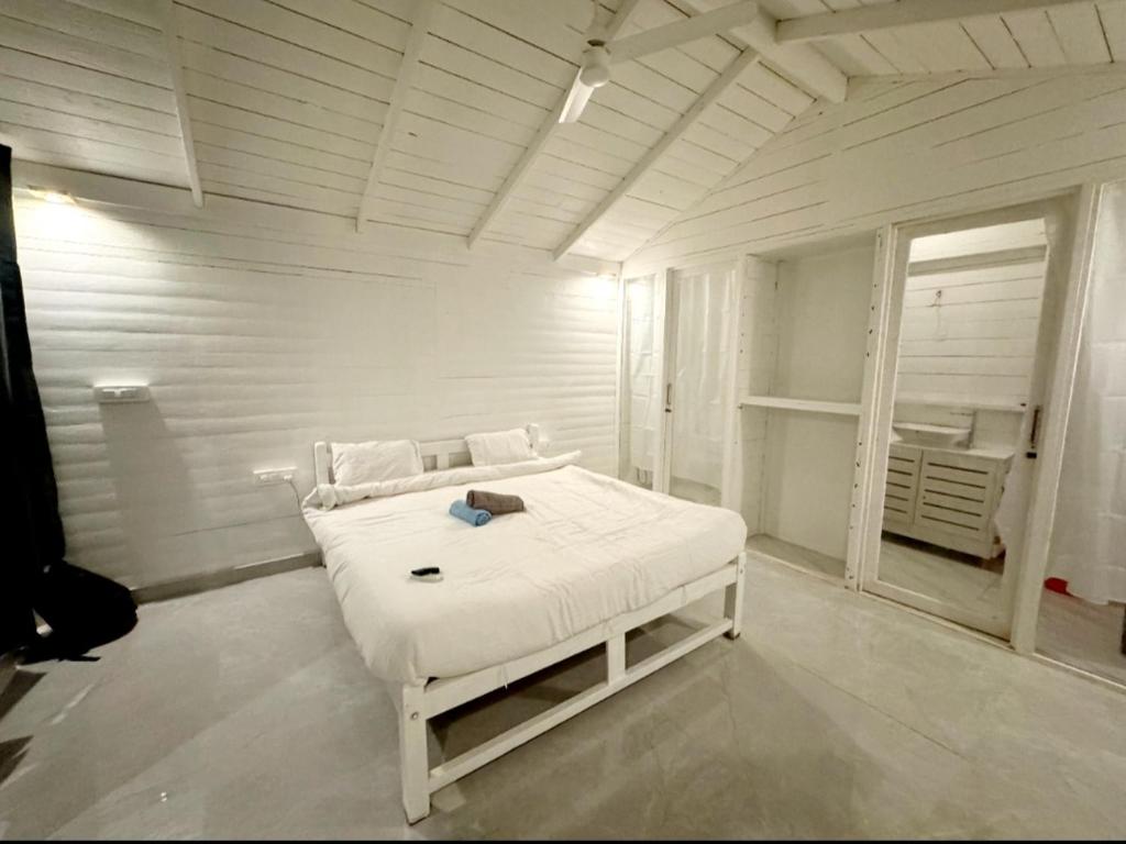 Tempat tidur dalam kamar di Palolem Beach View Inn