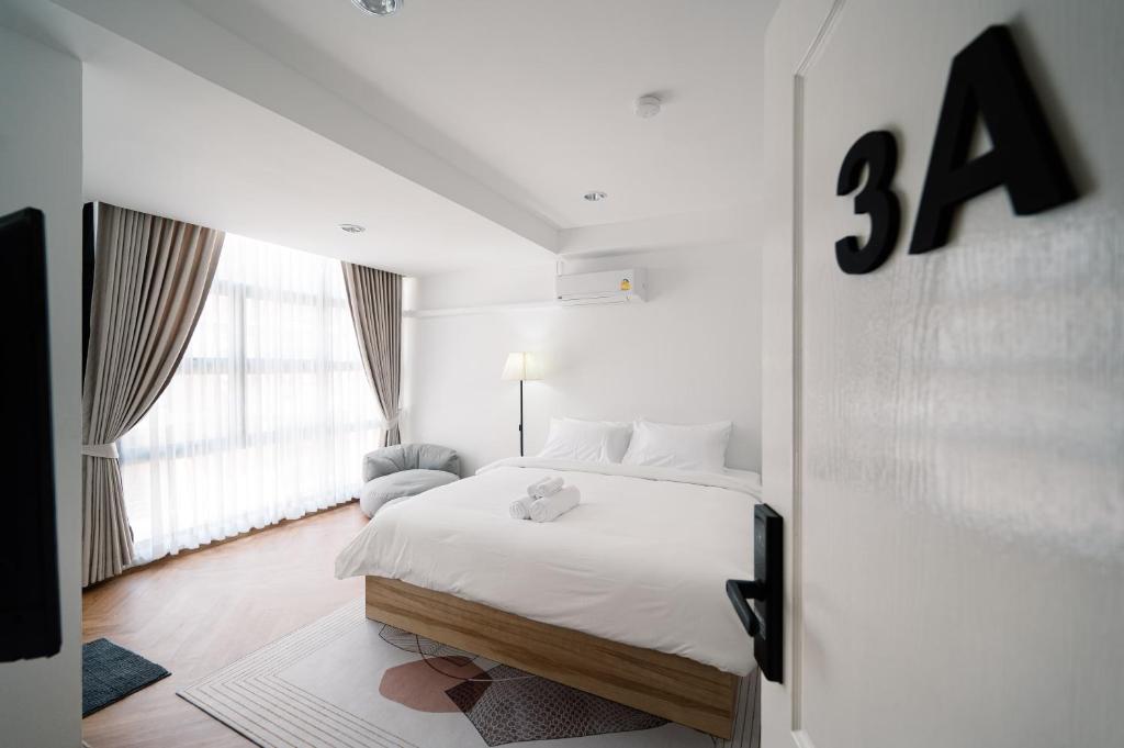 Postel nebo postele na pokoji v ubytování Mitt Haus (Lat Phrao Soi 5)