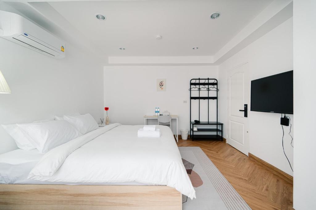 Postel nebo postele na pokoji v ubytování Mitt Haus (Lat Phrao Soi 5)