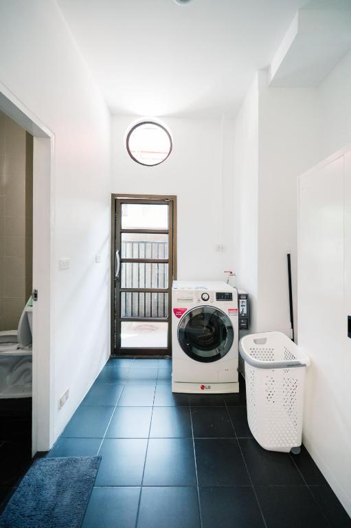 Postel nebo postele na pokoji v ubytování Mitt Haus (Lat Phrao Soi 5)