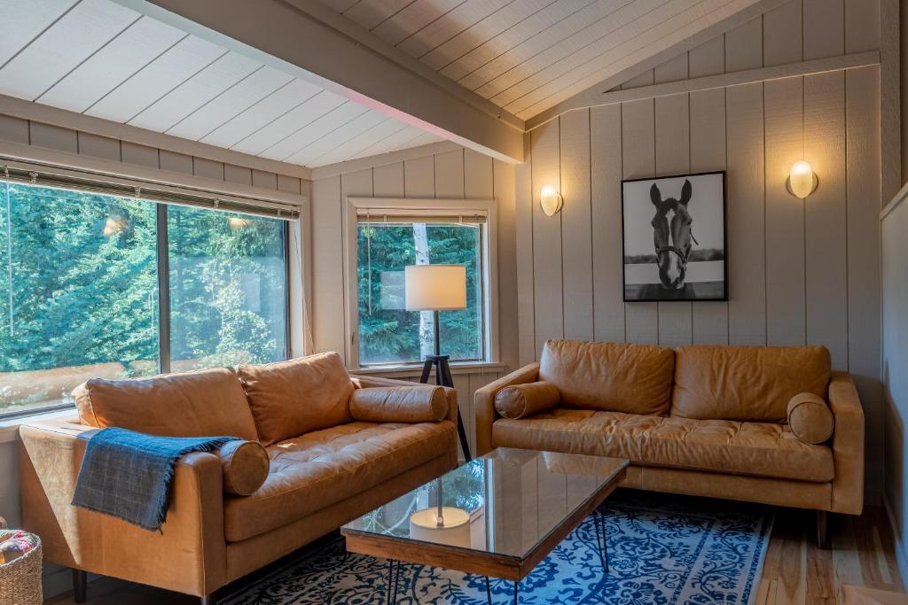 a living room with two couches and a table at Villager Condo 1203 - Newly Remodeled and Resort Amenities in Sun Valley