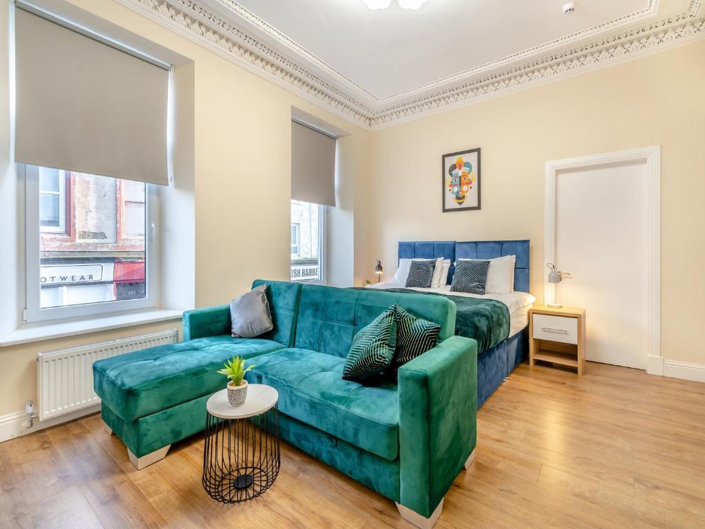 a living room with a couch and a bed at Apartment One - Uk44284 in Arbroath