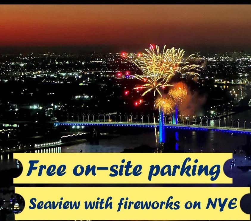 a sign with fireworks on a city at night at WSP luxury 2b2b apartment in CBD with free parking in Melbourne