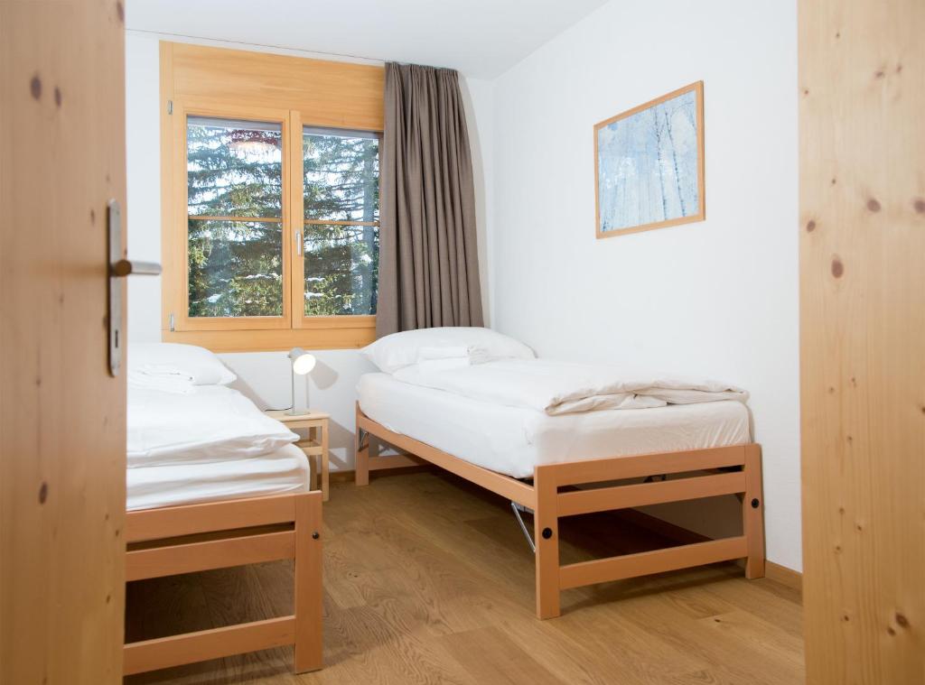 Postel nebo postele na pokoji v ubytování Holiday flat for 6 people Sot Valos Lenzerheide centre