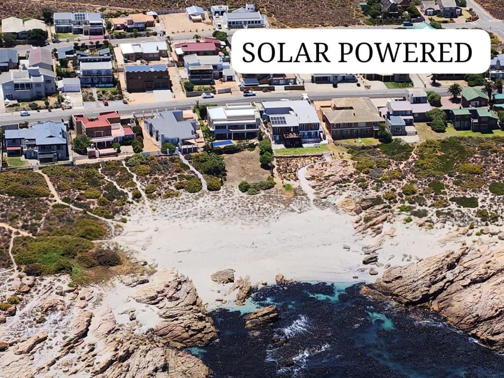 an aerial view of a resort on a rocky coast at Lambertsbay Beachfront in Lambertʼs Bay