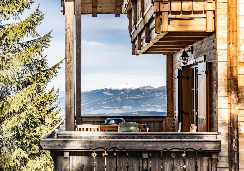 a balcony with a view of the mountains at 1A Chalet Koralpe - im Ski Gebiet - Sauna und Wellness in Hartelsberg