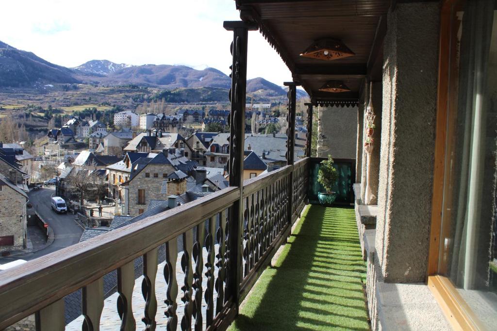 a balcony with a view of a city at El Balcón del Garmo in Sallent de Gállego