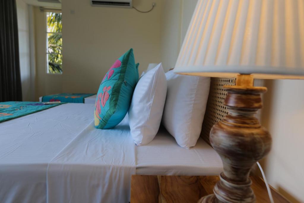 Postel nebo postele na pokoji v ubytování Coop Safari Hotel