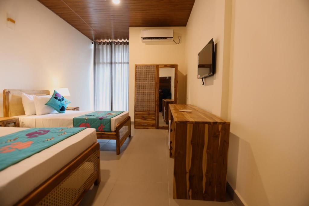 Postel nebo postele na pokoji v ubytování Coop Safari Hotel
