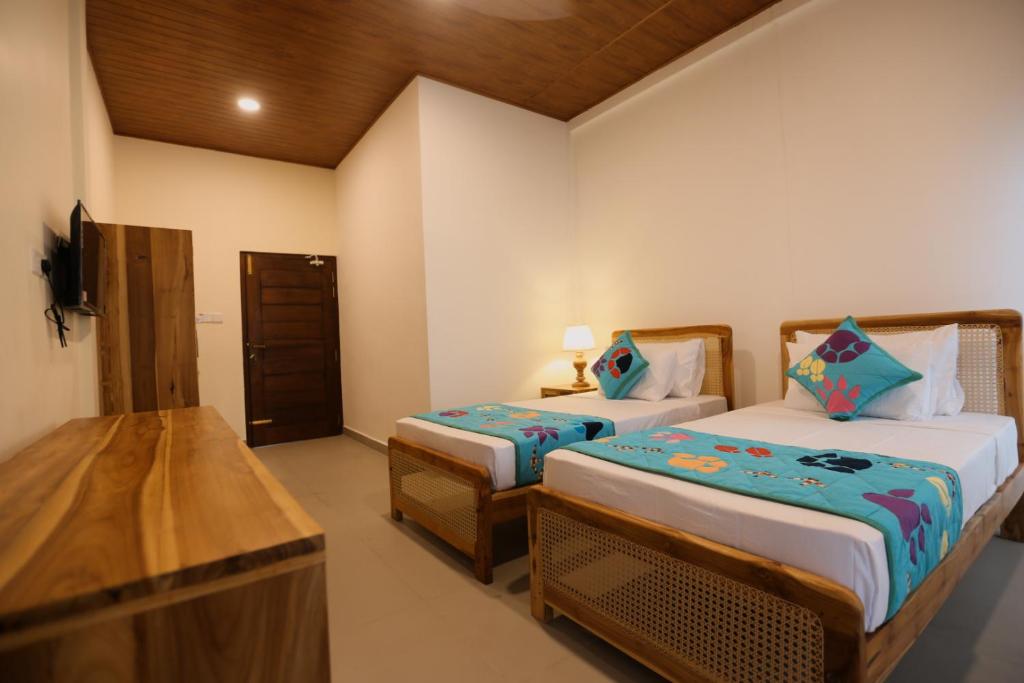 Postel nebo postele na pokoji v ubytování Coop Safari Hotel