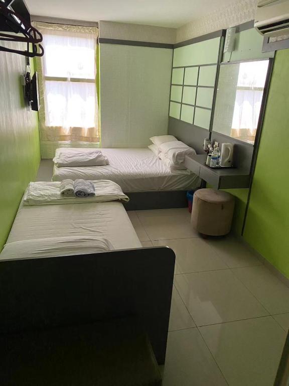 Postel nebo postele na pokoji v ubytování Best Hotel