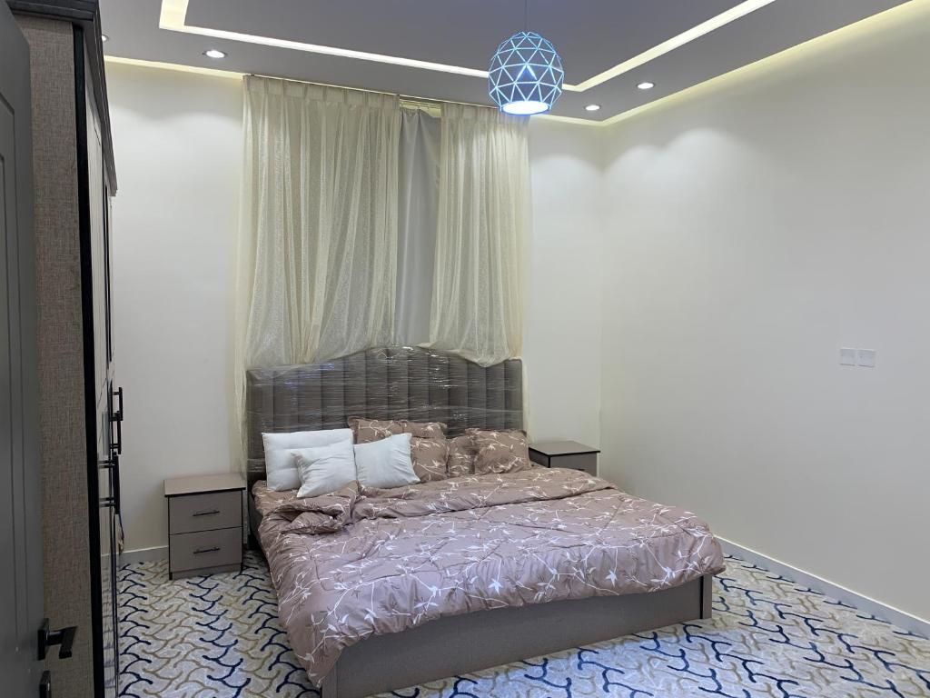 Postel nebo postele na pokoji v ubytování روبلكس فيلا