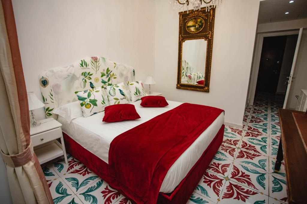 A bed or beds in a room at Delfini Trevi House