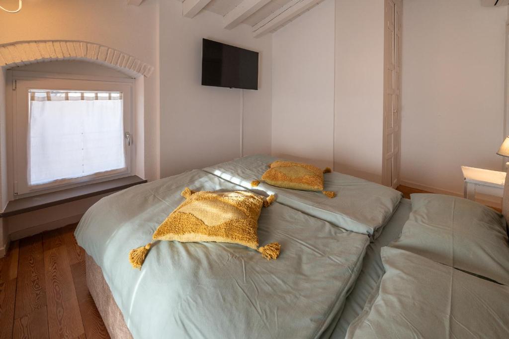 A bed or beds in a room at Ca Paradiso