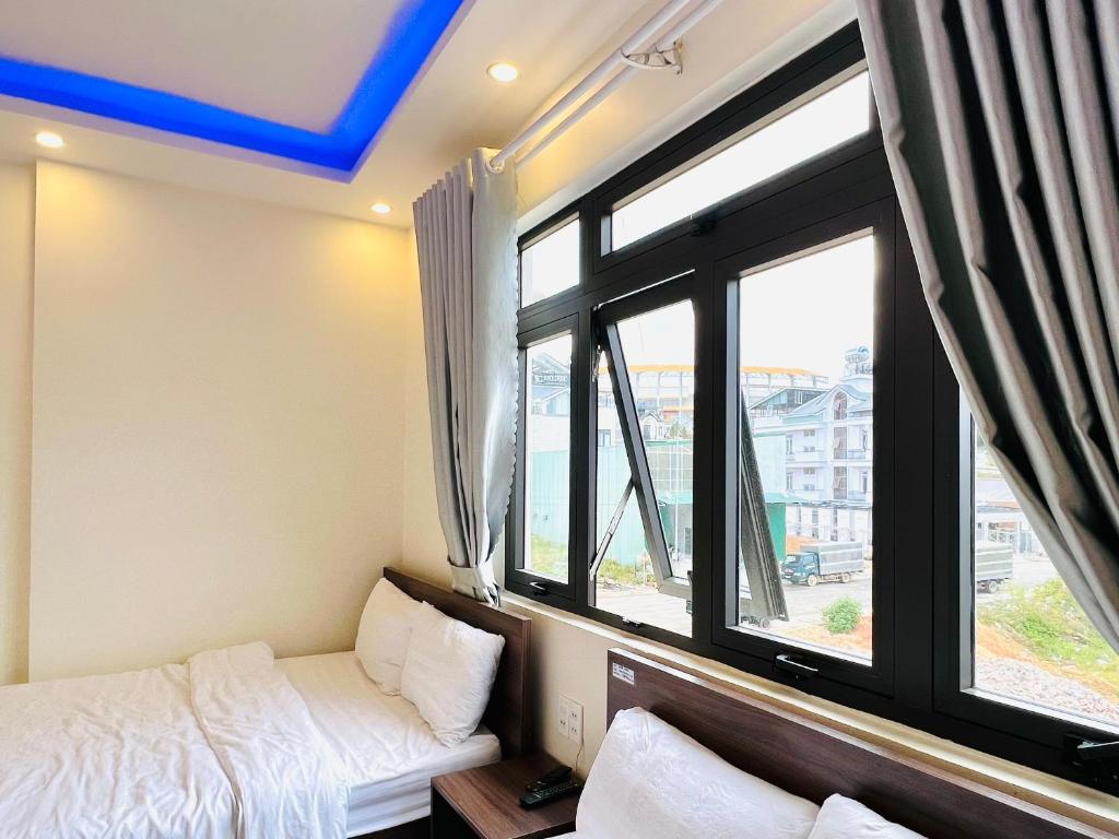Postel nebo postele na pokoji v ubytování Hotel Duy Dũng - Đà Lạt